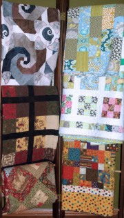 rack of quilts