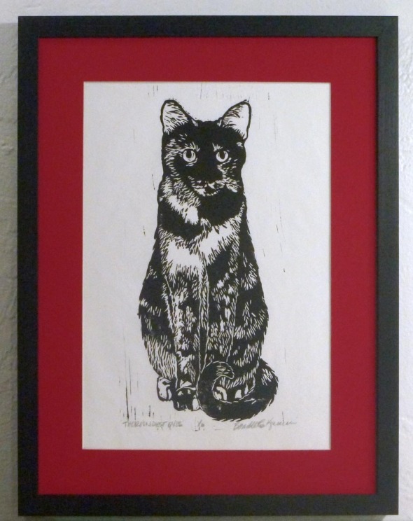block print in black ink with red mat