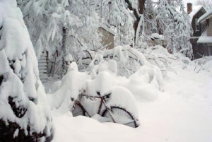 photo of bicycle buried in snow