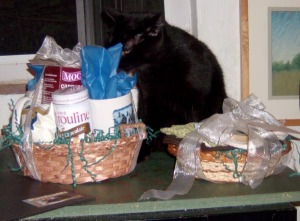black cat with baskets of gifts