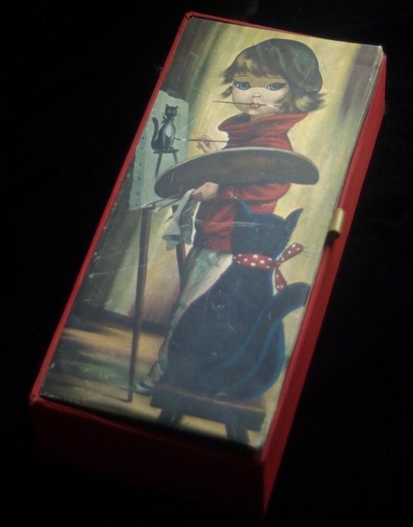 notions box with little girl artist and black cat