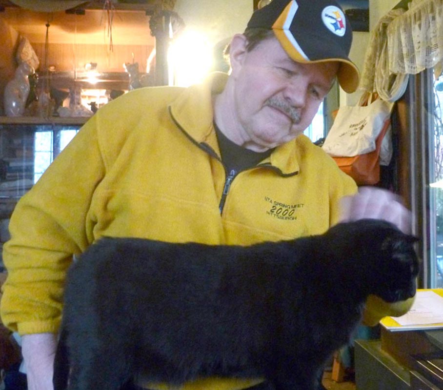 man with black cat